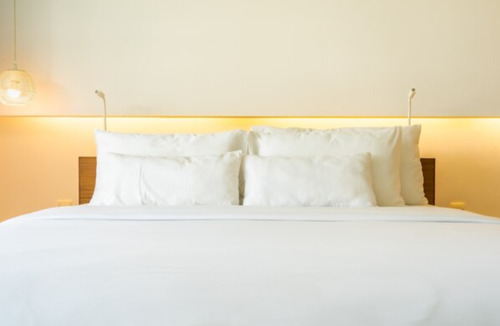 hotel white beds and bed sheets